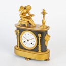 A Empire clock with a reading putti