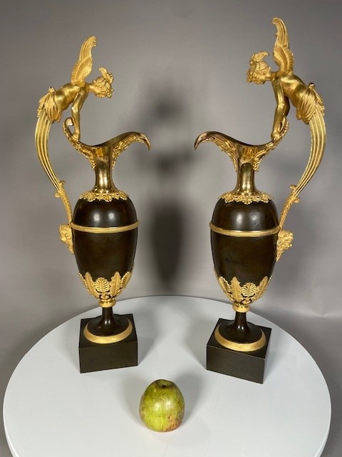 A pair vof Empire gilt and patinated bronze ewers attributed to Claude Galle