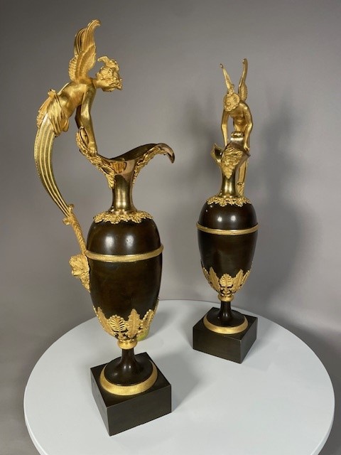 A pair vof Empire gilt and patinated bronze ewers attributed to Claude Galle