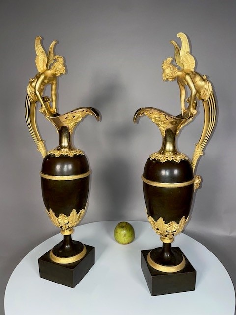 A pair vof Empire gilt and patinated bronze ewers attributed to Claude Galle