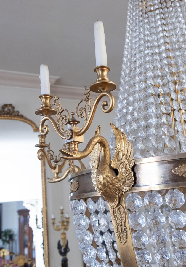 A palatial sze pair of crystal and bronze chandeliers 