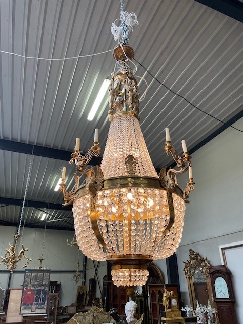 A palatial sze pair of crystal and bronze chandeliers 