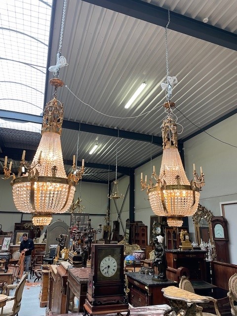 A palatial sze pair of crystal and bronze chandeliers 