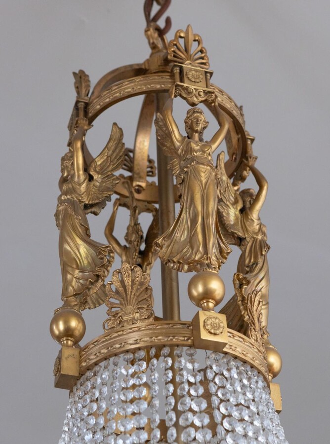 A palatial sze pair of crystal and bronze chandeliers 