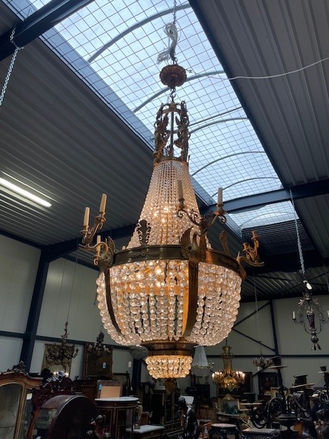 A palatial sze pair of crystal and bronze chandeliers 