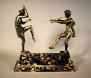 Art Deco Sculpture Bacchus playing Flute for a Dancing Nymph on a Portor Marble Base 