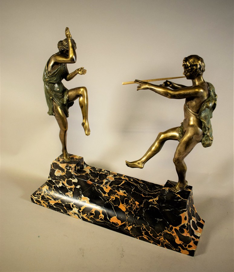 Art Deco Sculpture Bacchus playing Flute for a Dancing Nymph on a Portor Marble Base 